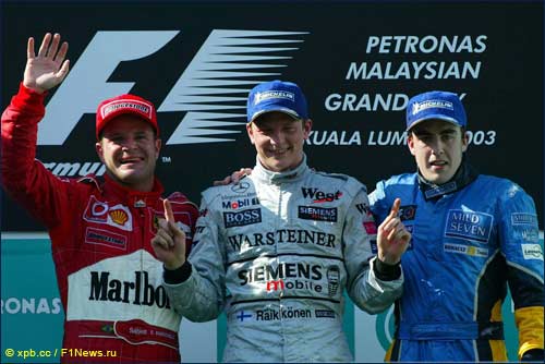 Рубенс Баррикелло, Кими Райкконен и Фернандо Алонсо на призовом подиуме Гран При Малайзии 2003 года